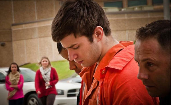 Seth Fontenot is escorted to the Lafayette Parish Courthouse.